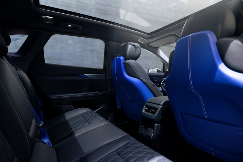 Back Seat View of the 2026 OPTIQ-V Blue Front Seats, Sun Roof, and Interior | Powell Watson Cadillac of Laredo in Laredo TX